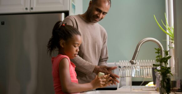 father and daughter doing chores